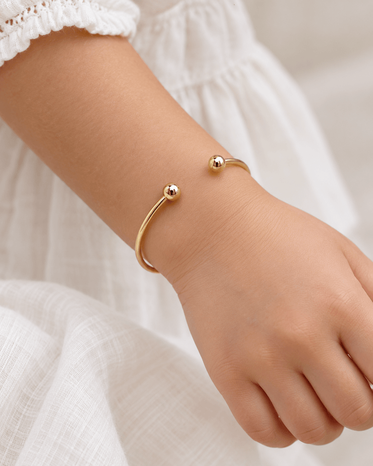 9CT Yellow Gold Open Cuff Kids Bangle with Spherical Ends - Hyman’s Jewellers