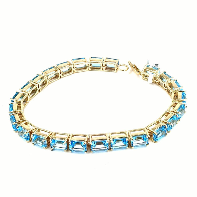 Women's 9ct Yellow Gold Tennis Bracelet with Emerald Cut Blue Topaz - Hyman’s Jewellers