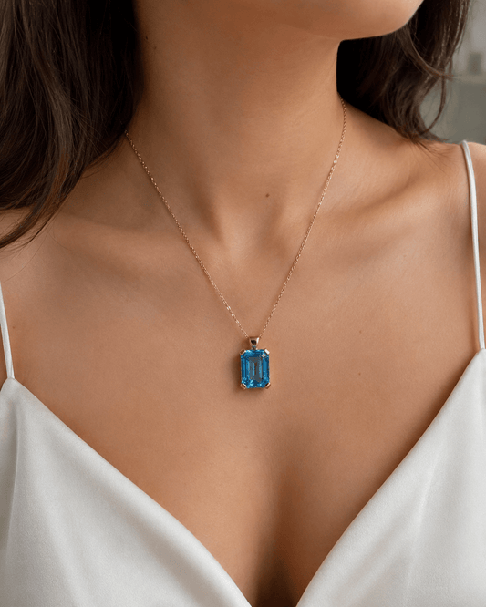 Emerald Cut Blue Topaz Solitaire Pendant in 9ct Yellow Gold 7.2g - Hyman’s Jewellers