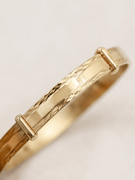 Engraved Yellow Gold Expanding Baby Bangle - Hyman’s Jewellers