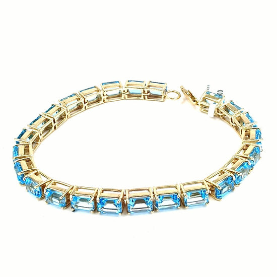 Women's 9ct Yellow Gold Tennis Bracelet with Emerald Cut Blue Topaz - Hyman’s Jewellers