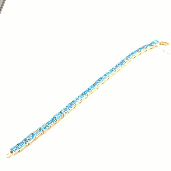 Women's 9ct Yellow Gold Tennis Bracelet with Emerald Cut Blue Topaz - Hyman’s Jewellers